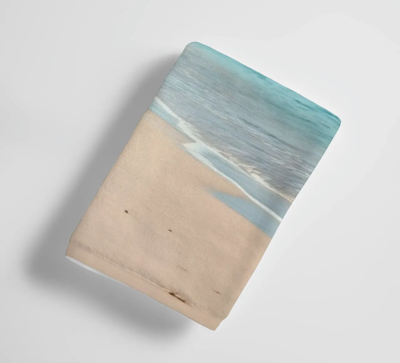 Serene coastline with soft waves lapping against pristine towel by DesignDoodle