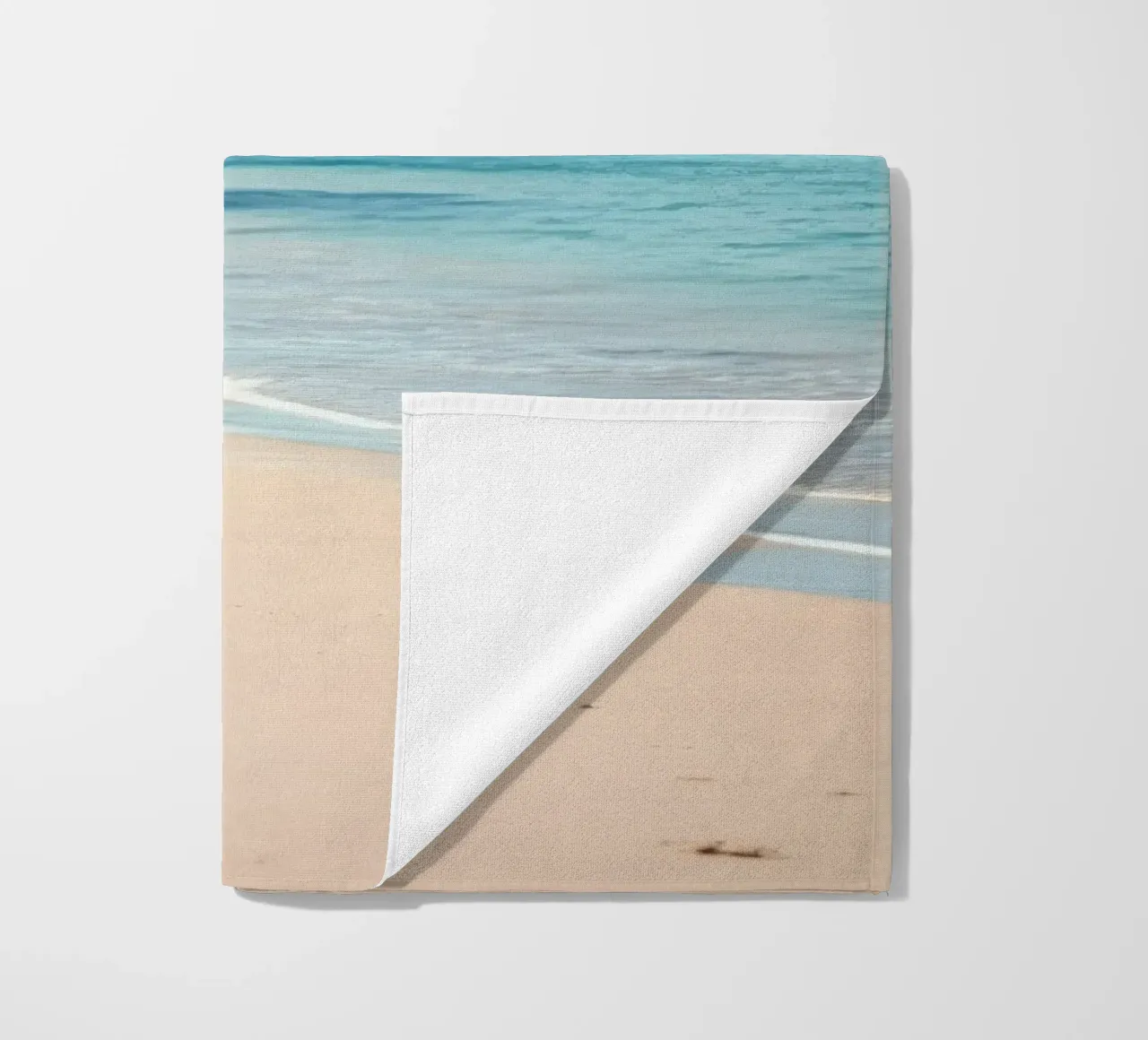 Serene coastline with soft waves lapping against pristine beach towel by DesignDoodle