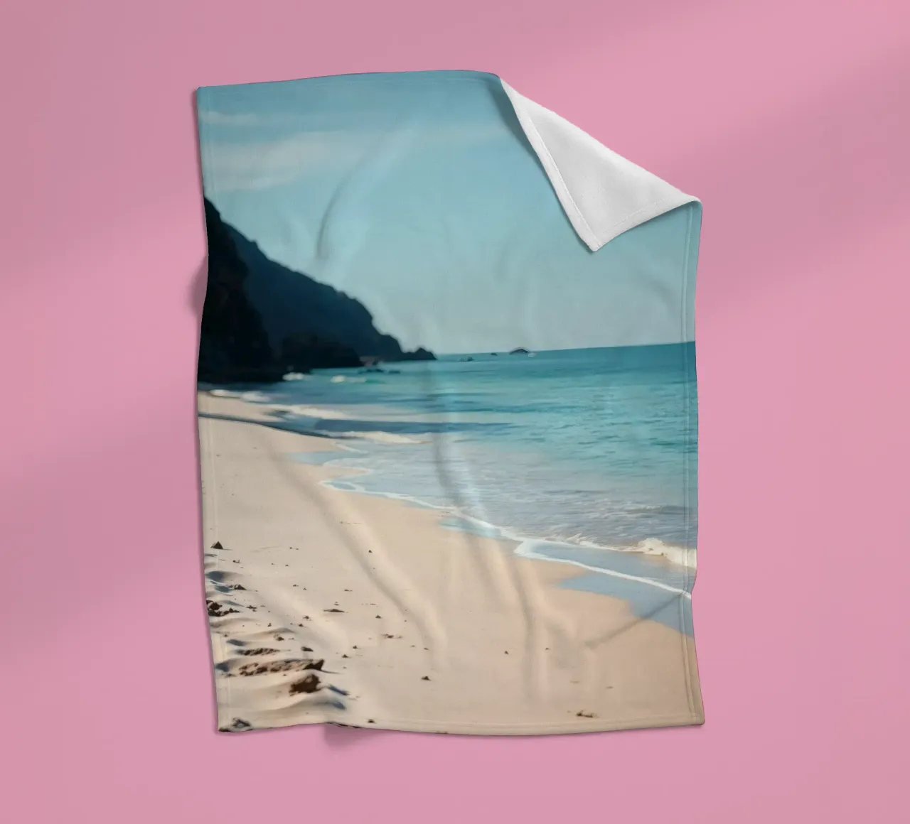 Serene coastline with soft waves lapping against pristine fleece blanket by DesignDoodle