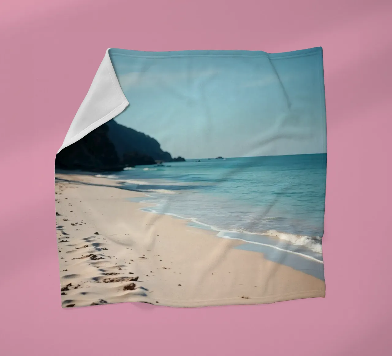 Serene coastline with soft waves lapping against pristine fleece blanket by DesignDoodle