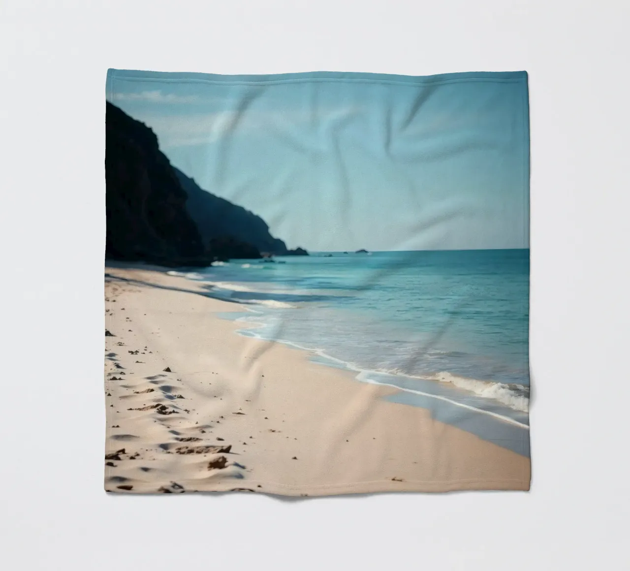 Serene coastline with soft waves lapping against pristine fleece blanket by DesignDoodle
