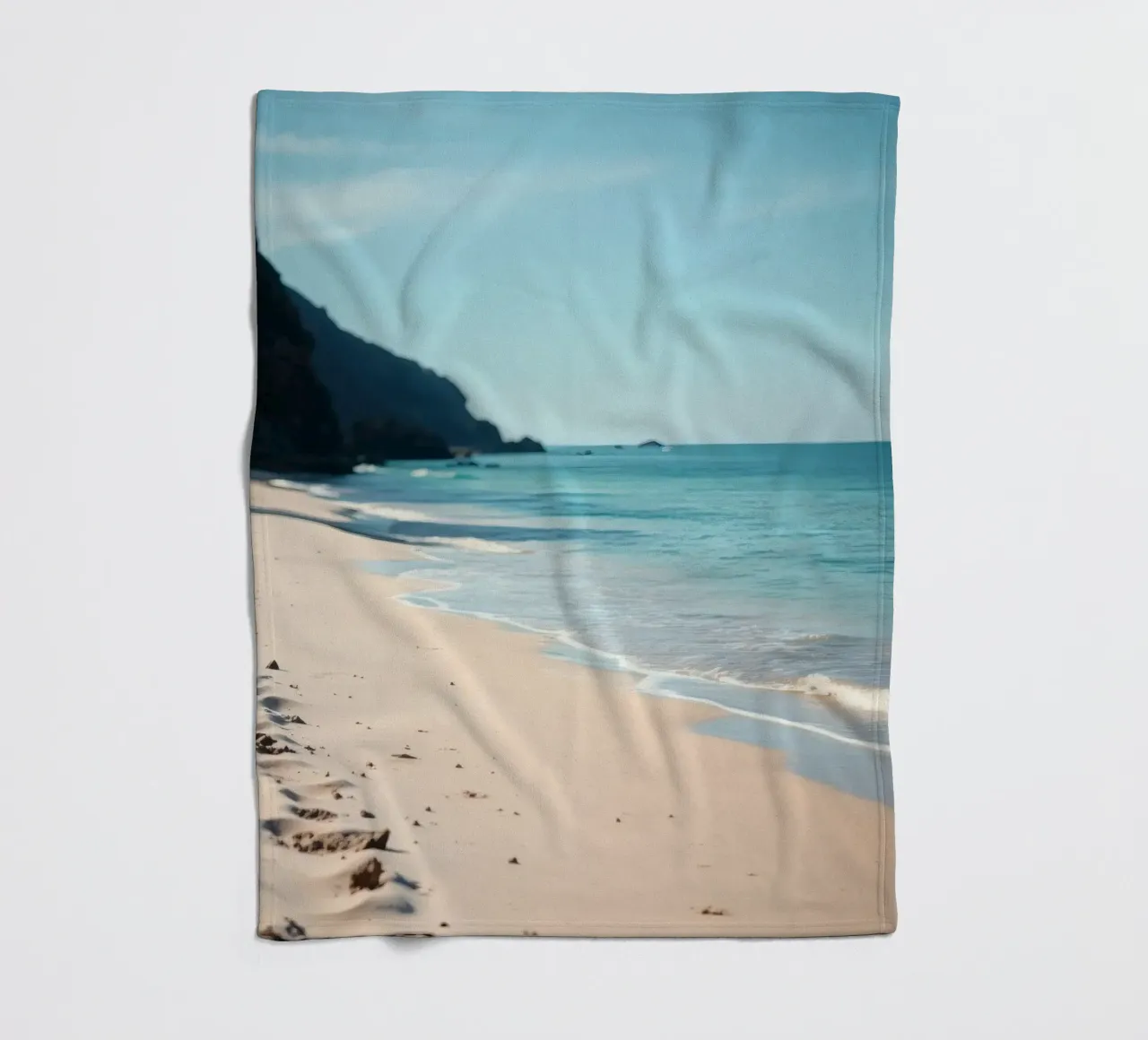 Serene coastline with soft waves lapping against pristine fleece blanket by DesignDoodle