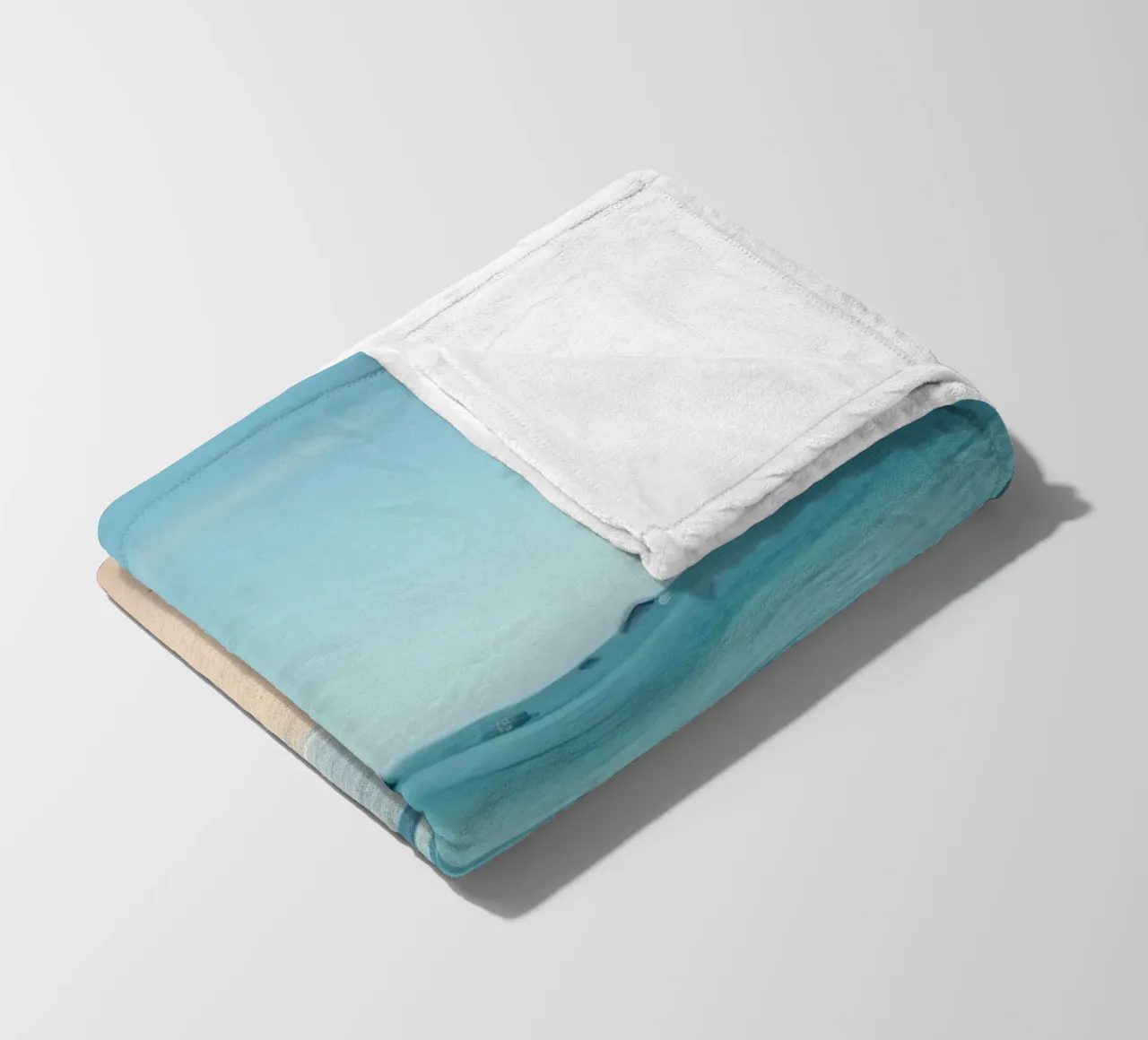 Serene coastline with soft waves lapping against pristine fleece blanket by DesignDoodle