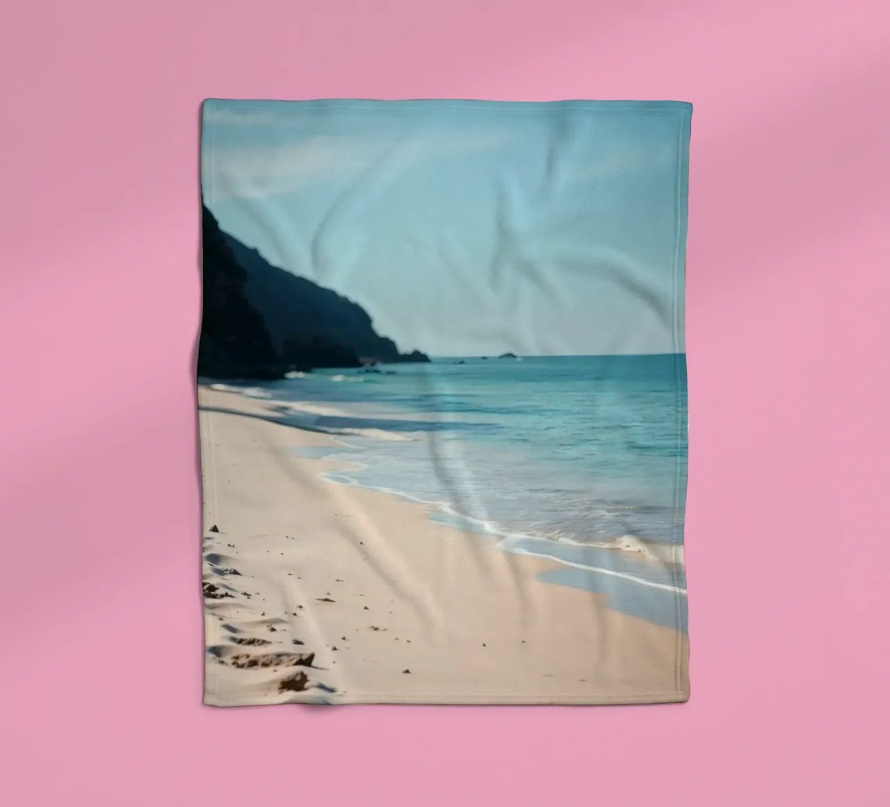 Serene coastline with soft waves lapping against pristine fleece blanket by DesignDoodle