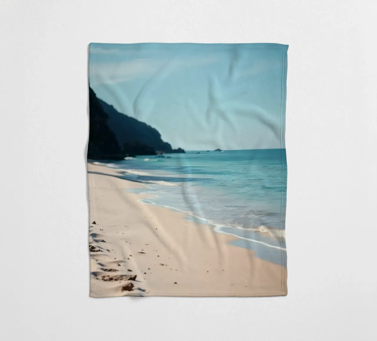 Serene coastline with soft waves lapping against pristine fleece blanket by DesignDoodle