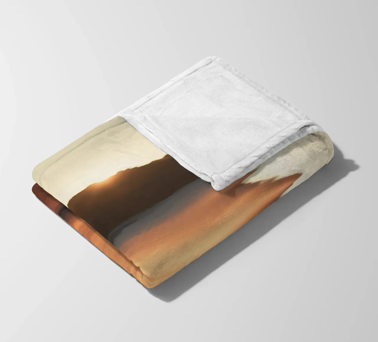 Sunset casts warm glow on sandy beach with gentle waves fleece blanket by DesignDoodle