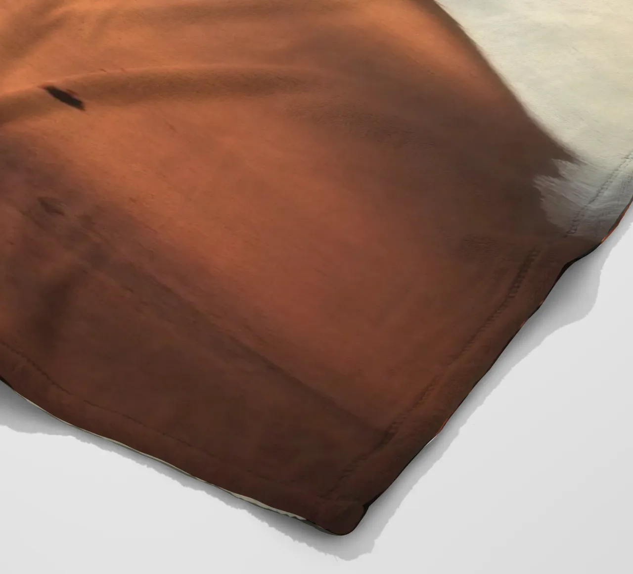 Sunset casts warm glow on sandy beach with gentle waves fleece blanket by DesignDoodle