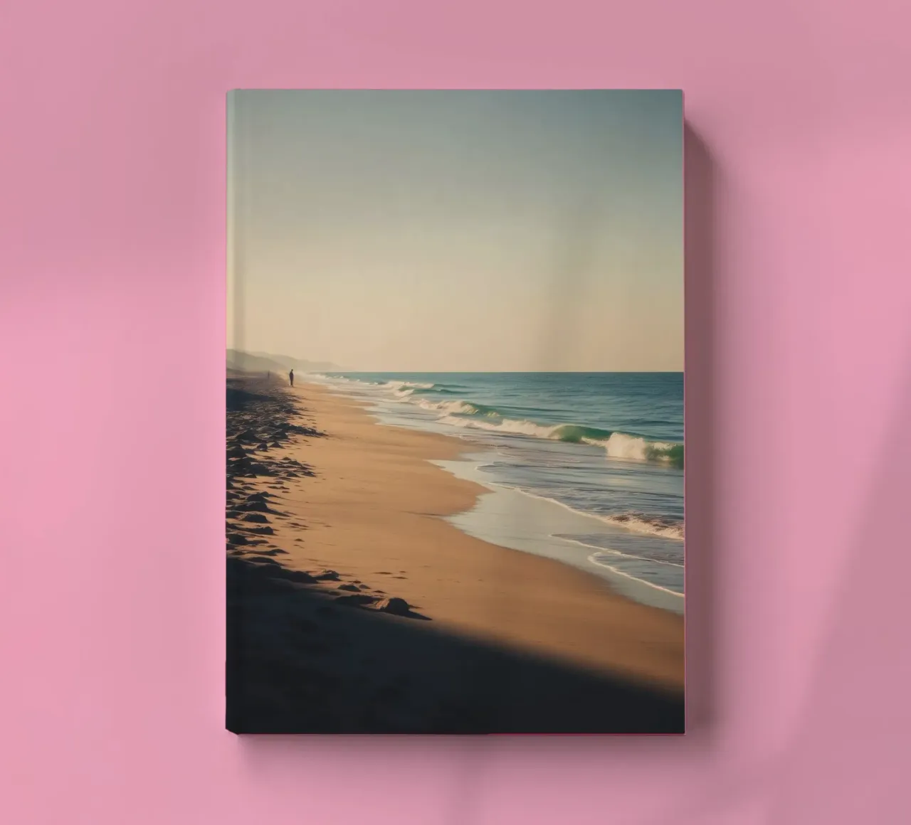Serene beach view at sunset with gentle waves lapping notebook by DesignDoodle