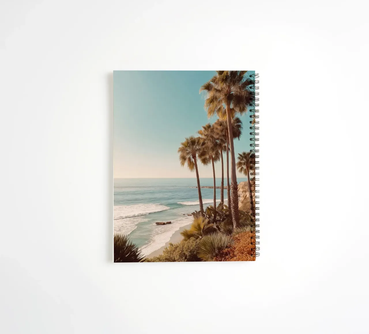 Sunset Palm Trees by the Ocean spiral notebook by Indigo Tides Art