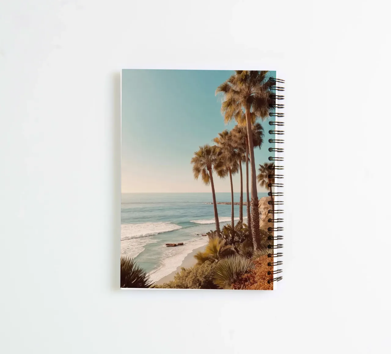 Sunset Palm Trees by the Ocean spiral notebook by Indigo Tides Art