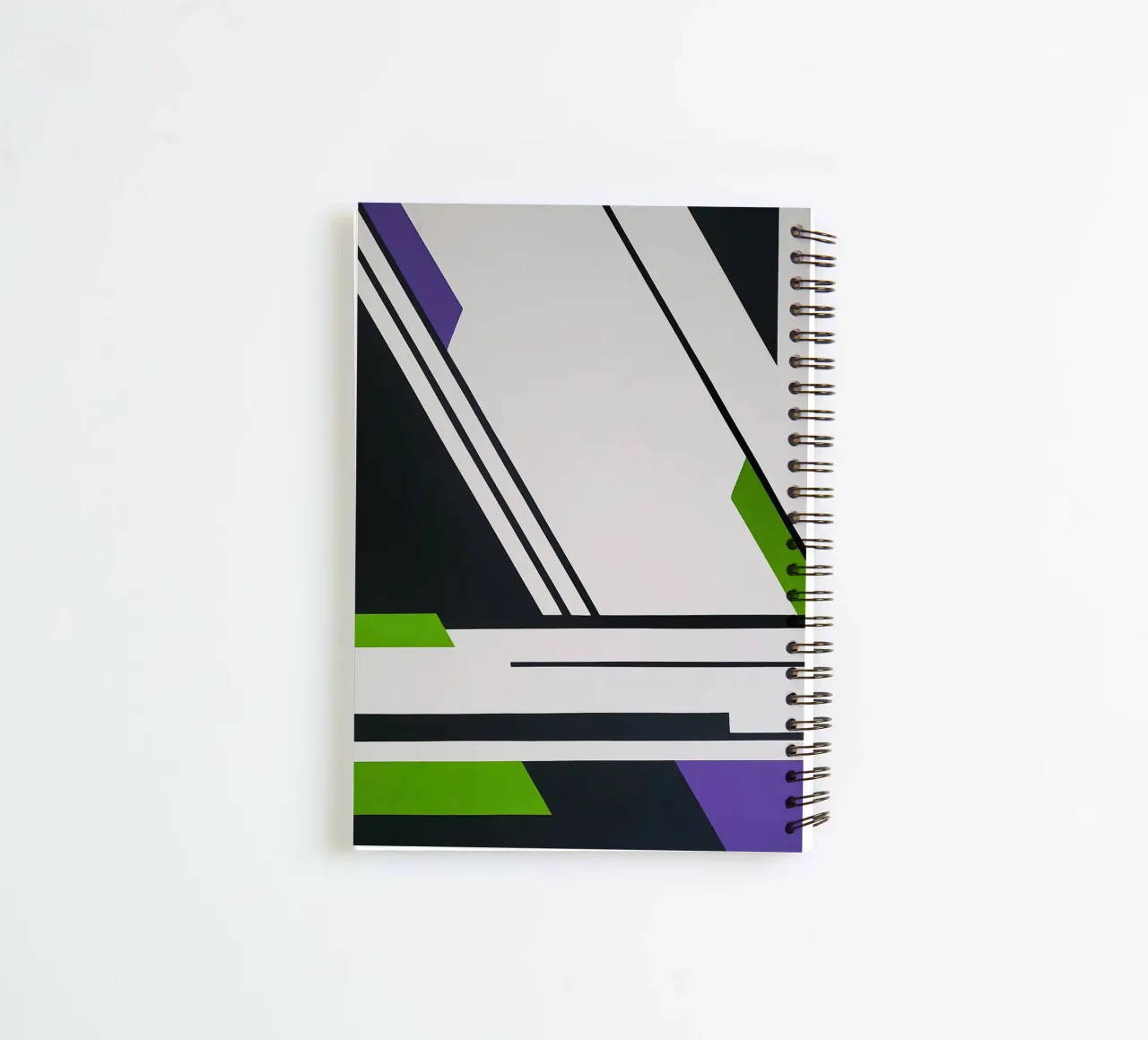 Sharp Angles and Bold Lines in Green and Purple spiral notebook by Artbyvo