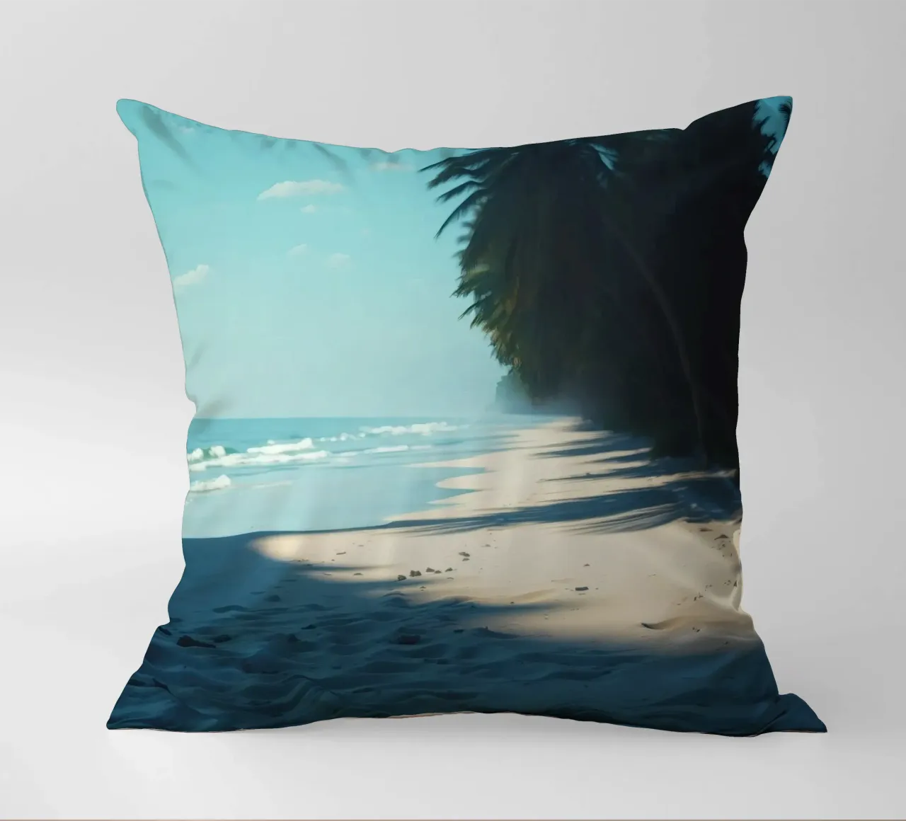 Serene beach with palm trees and gentle waves under a clear decorative cushion by DesignDoodle