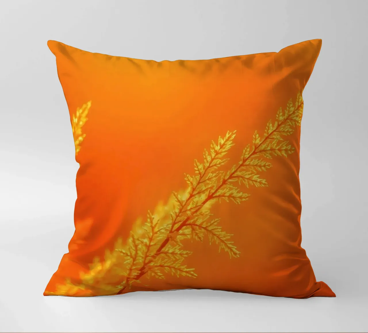 Vibrant golden background with delicate foliage illuminated decorative cushion by DesignDoodle