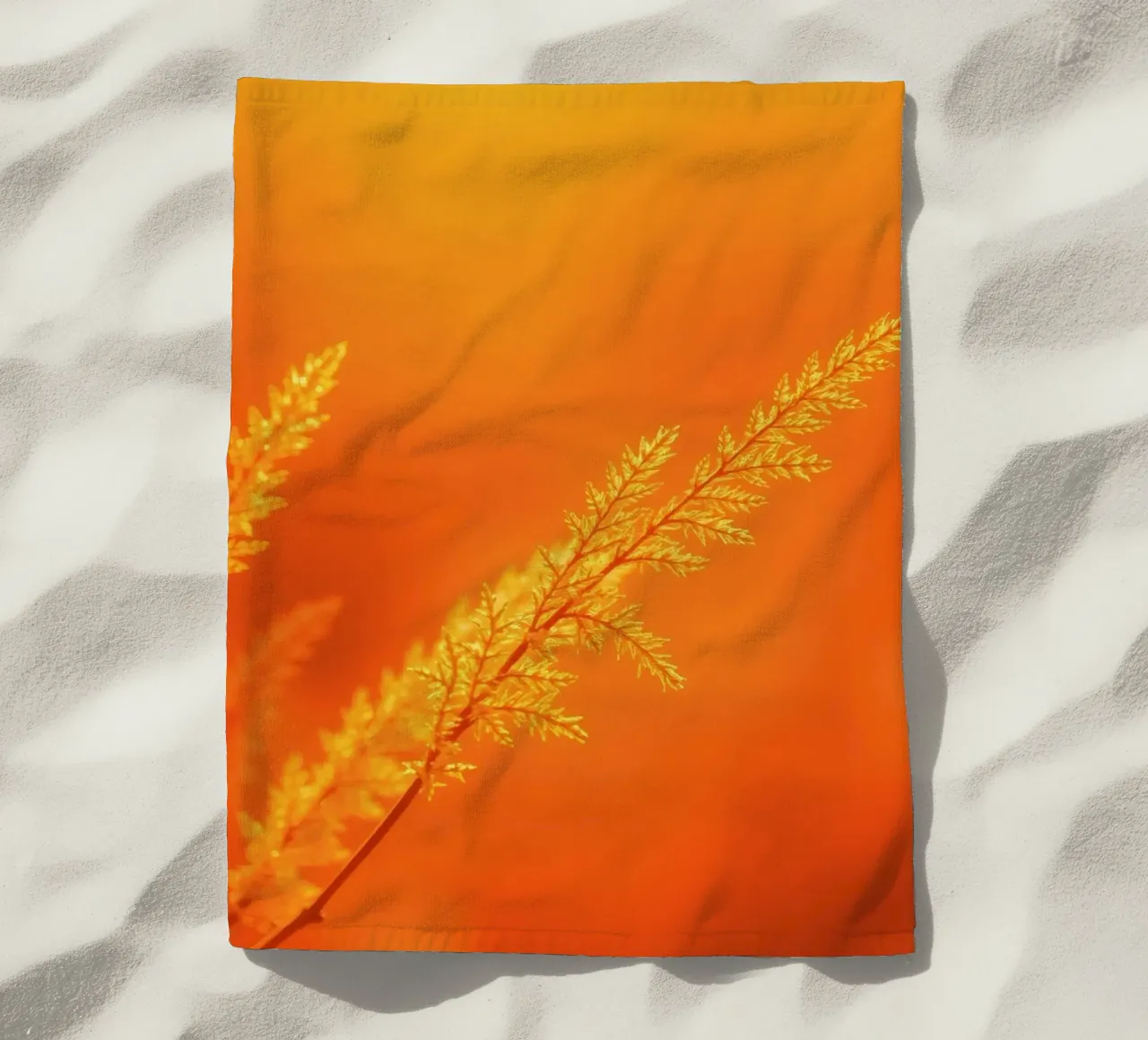 Vibrant golden background with delicate foliage illuminated beach towel by DesignDoodle