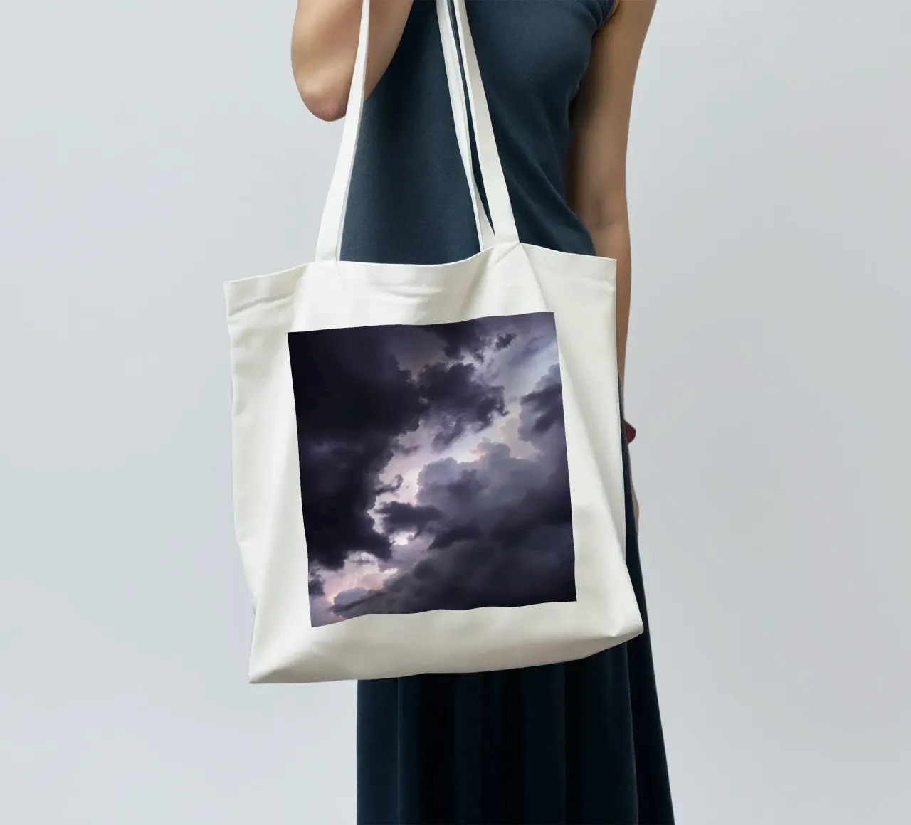 Dark and moody cloud formations create a dramatic sky tote bag by DesignDoodle