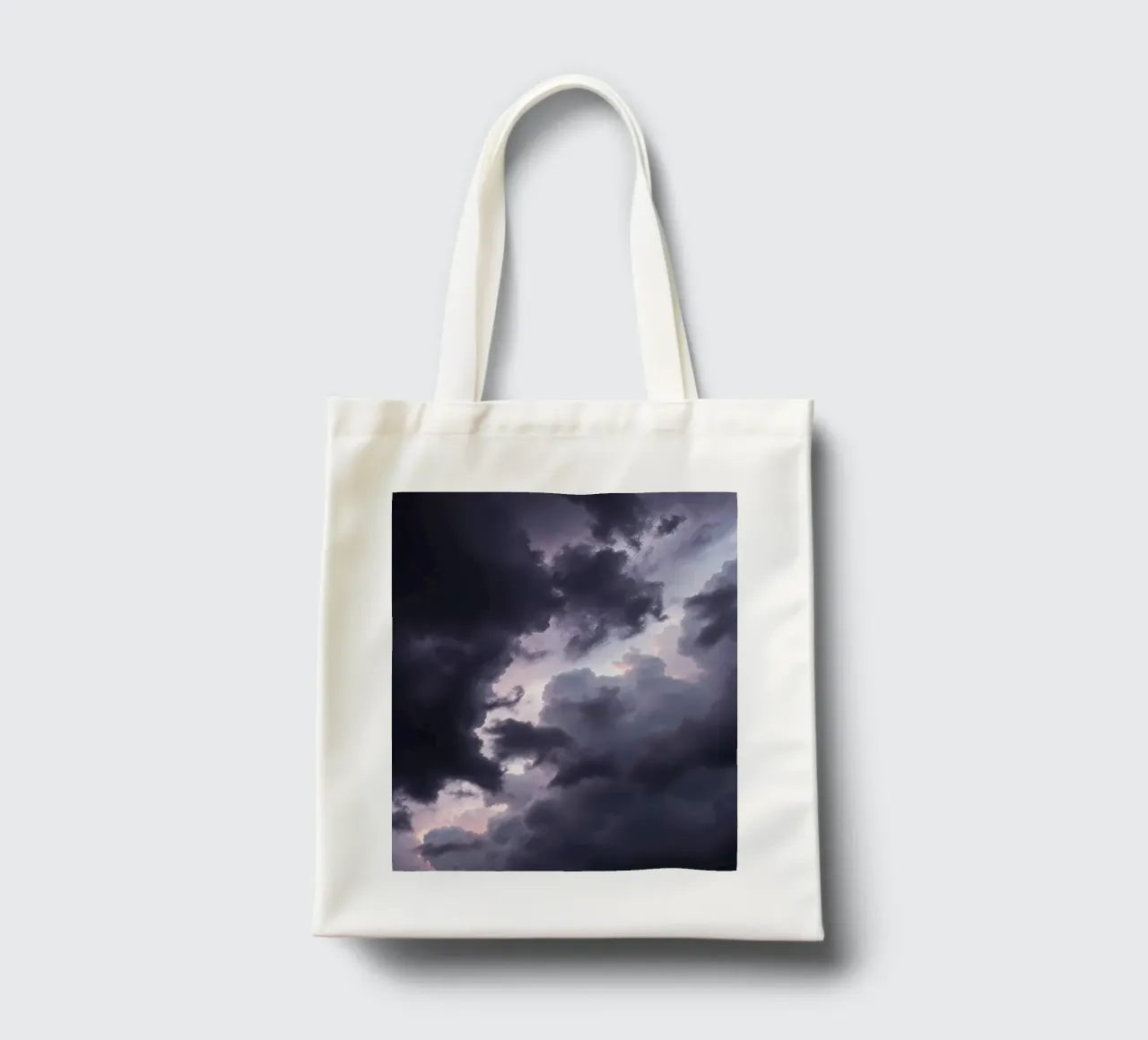 Dark and moody cloud formations create a dramatic sky tote bag by DesignDoodle