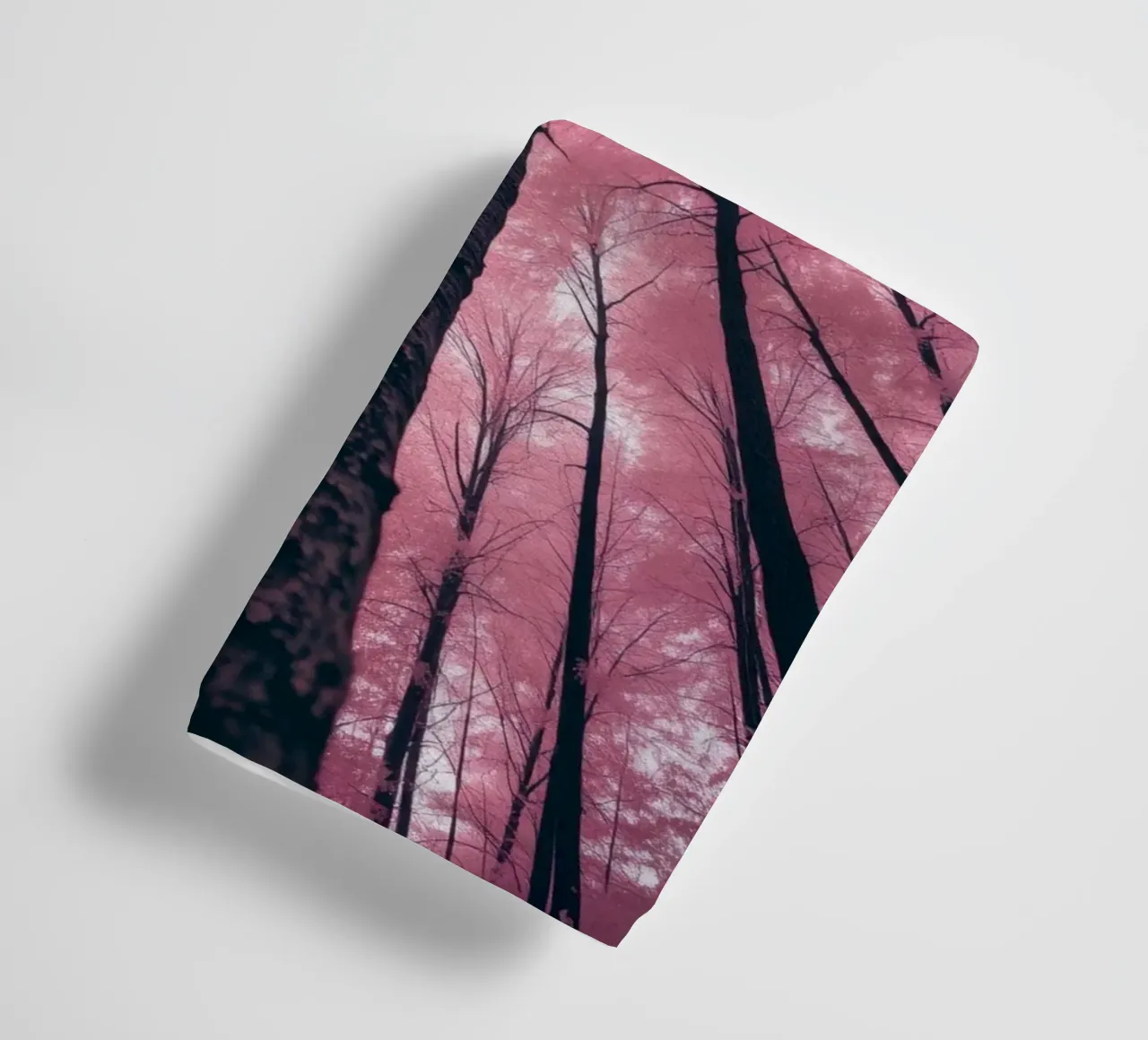 Vibrant abstract pink trees against a cloudy sky towel by DesignDoodle