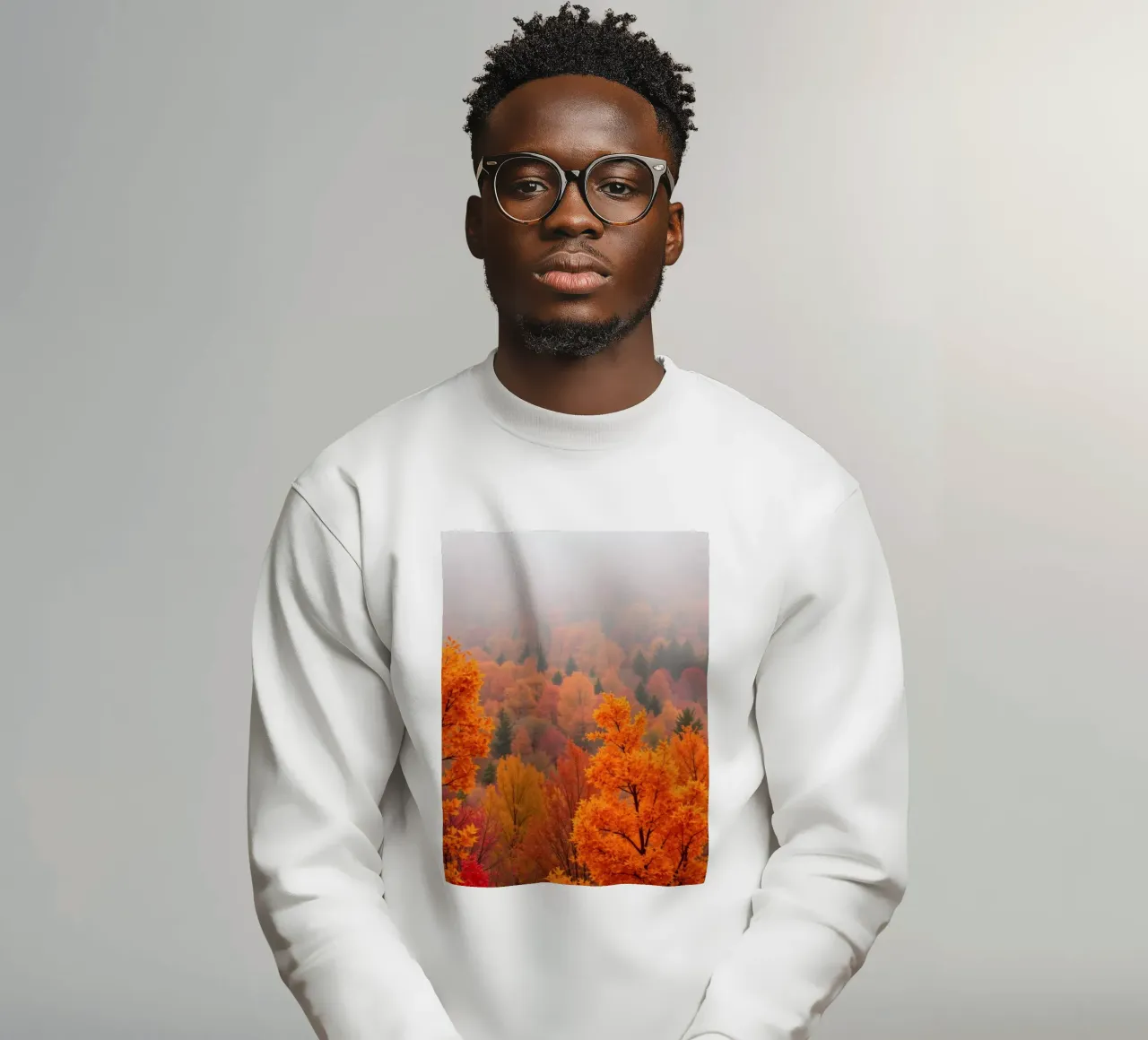fall foliage creating a stunning backdrop in a misty forest sweatshirt by DesignDoodle