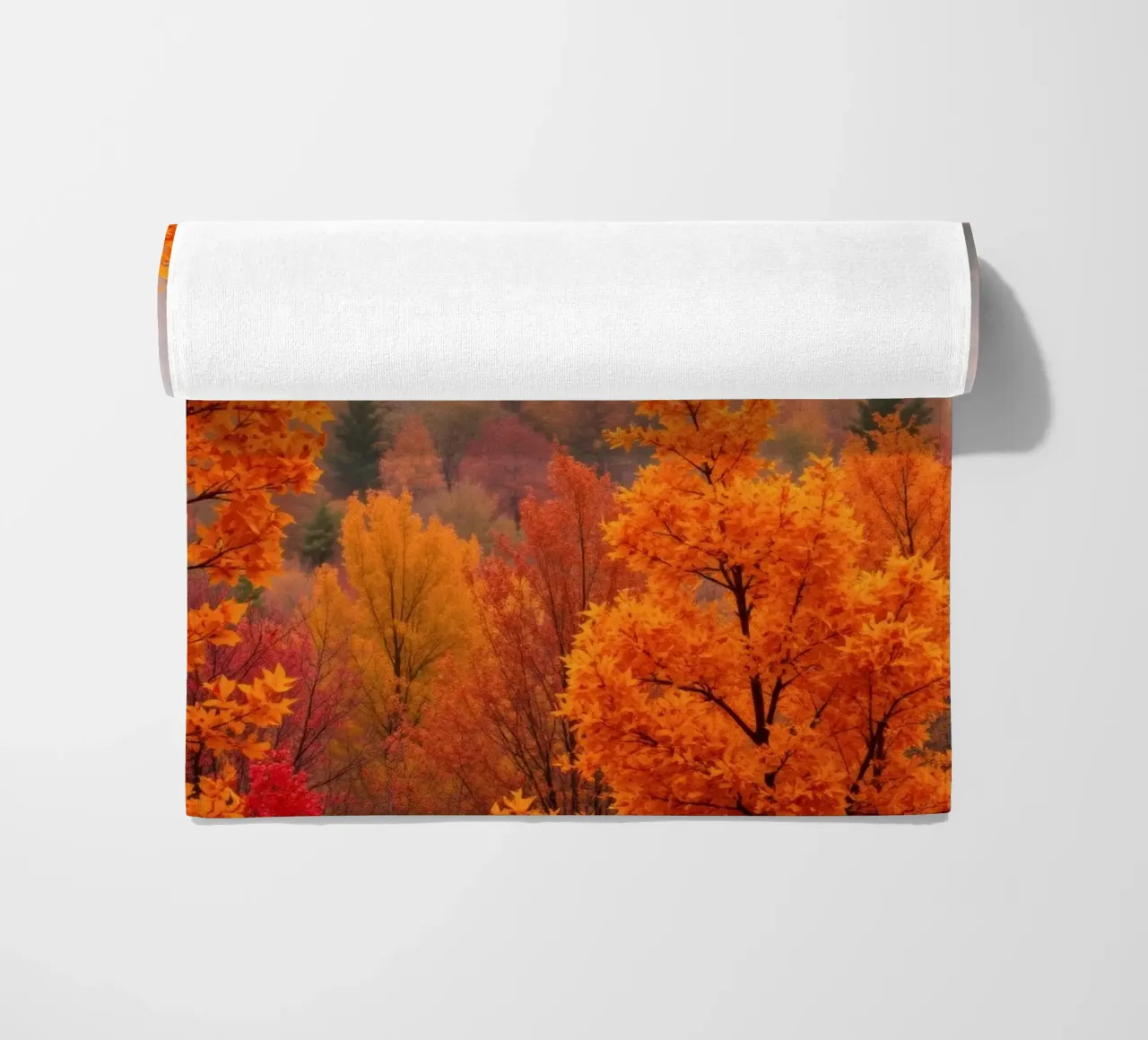 fall foliage creating a stunning backdrop in a misty forest beach towel by DesignDoodle