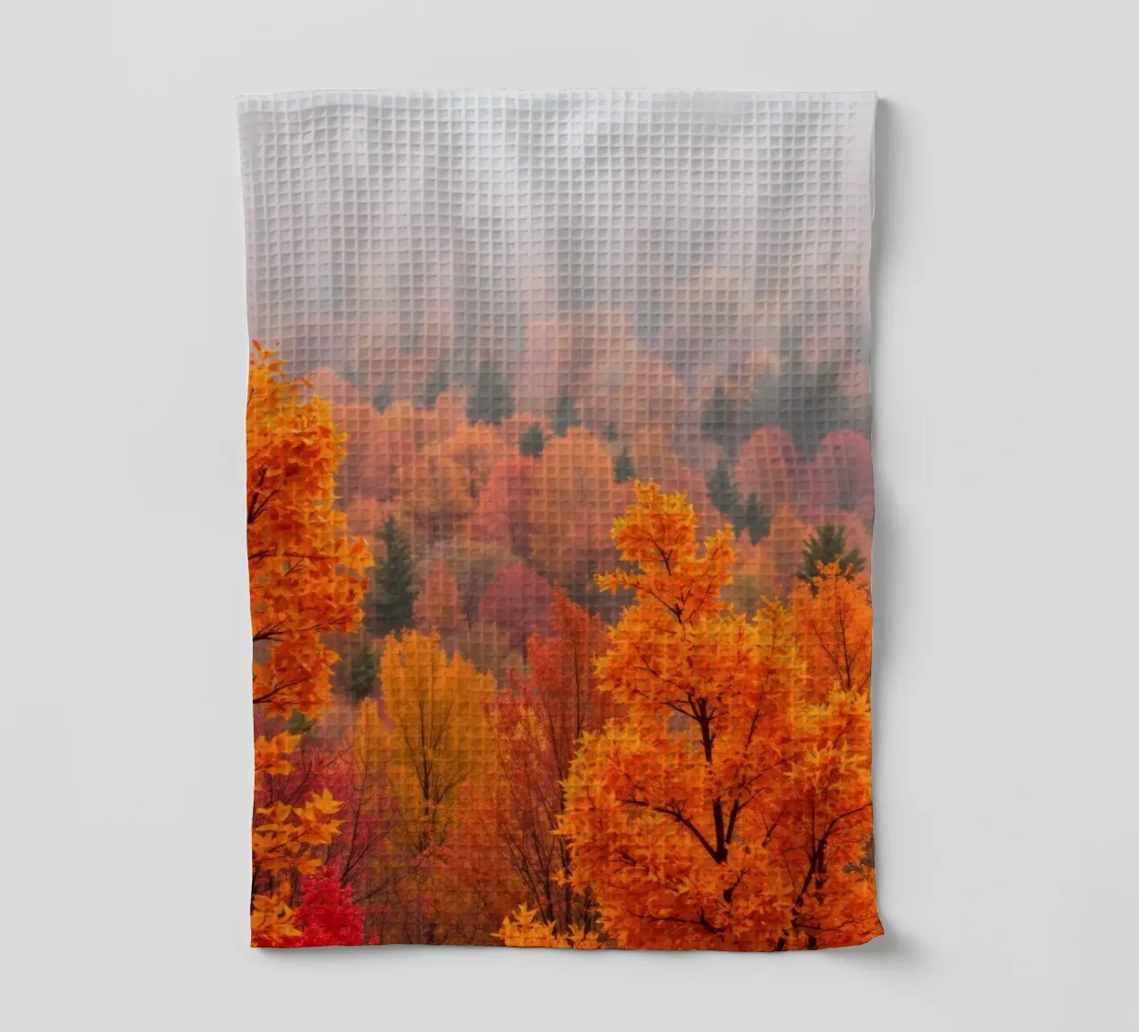 fall foliage creating a stunning backdrop in a misty forest tea towel by DesignDoodle