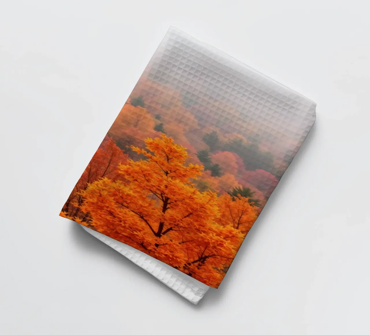 fall foliage creating a stunning backdrop in a misty forest tea towel by DesignDoodle