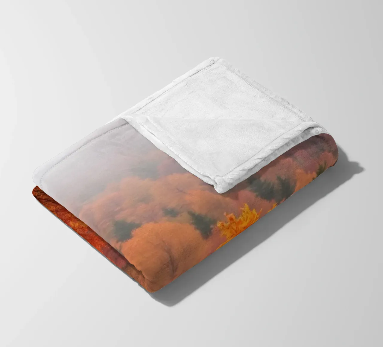fall foliage creating a stunning backdrop in a misty forest fleece blanket by DesignDoodle