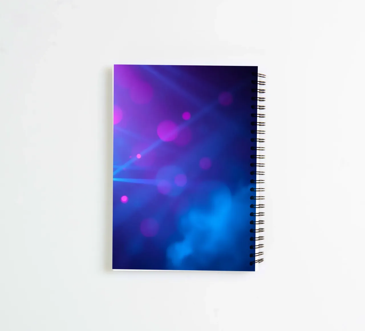 abstract design with blue and pink light rays spiral notebook by DesignDoodle