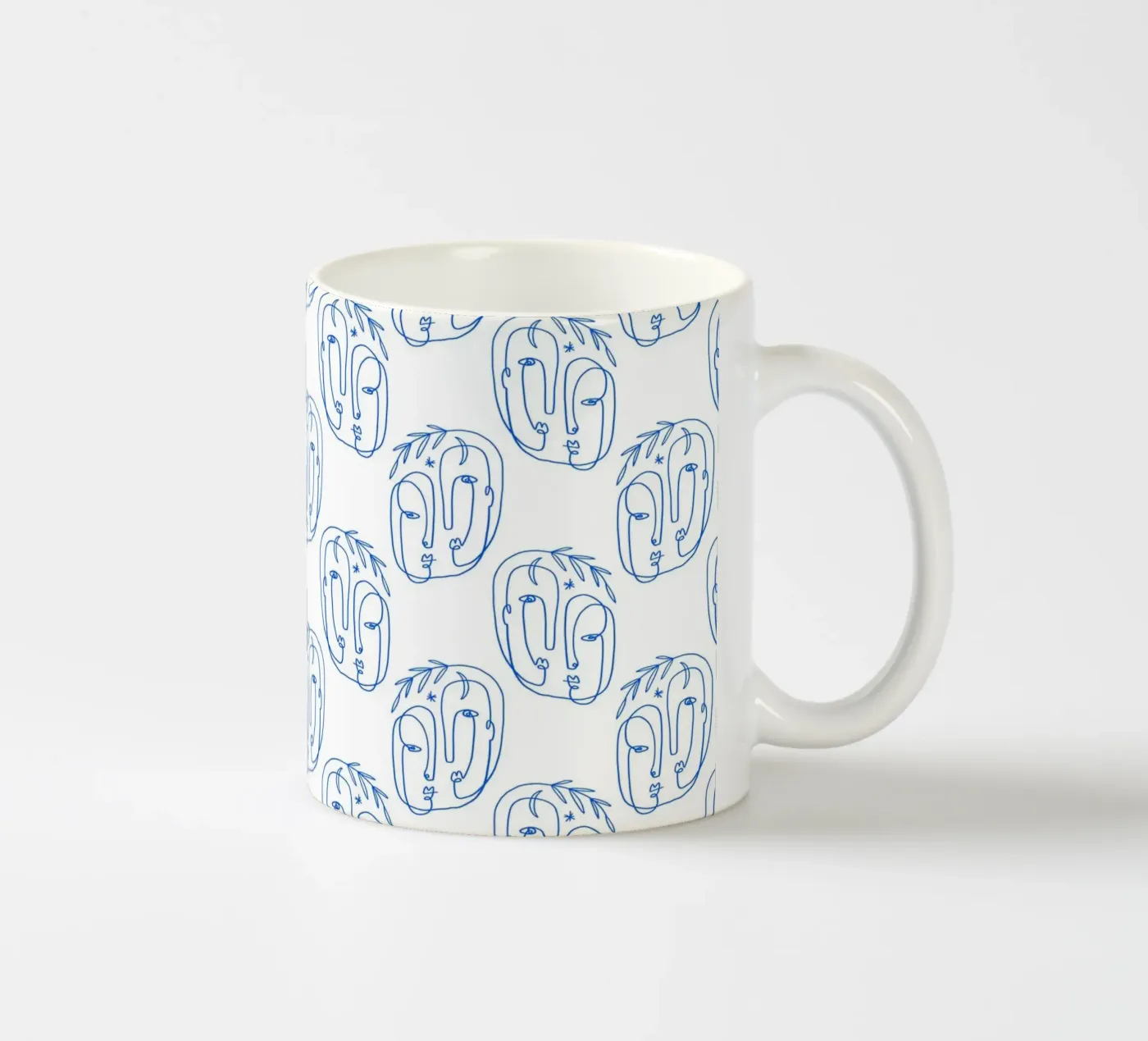 Faces Pattern ceramic mug by treechild