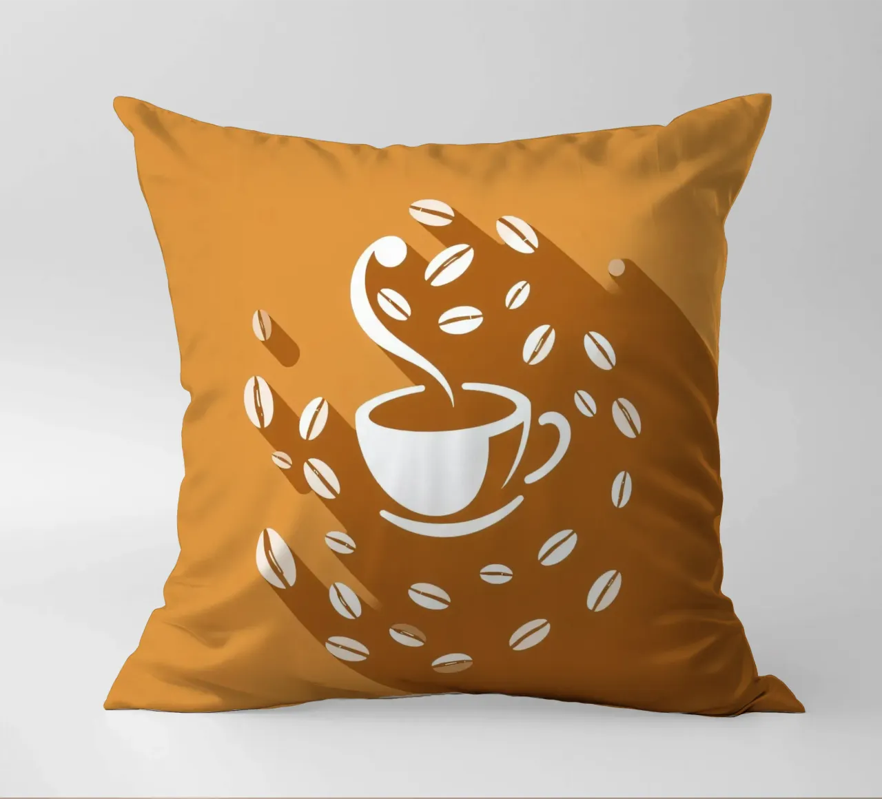 Una tazza di caffè fumante circondata da chicchi di caffè sparsi cuscino da DesignDoodle