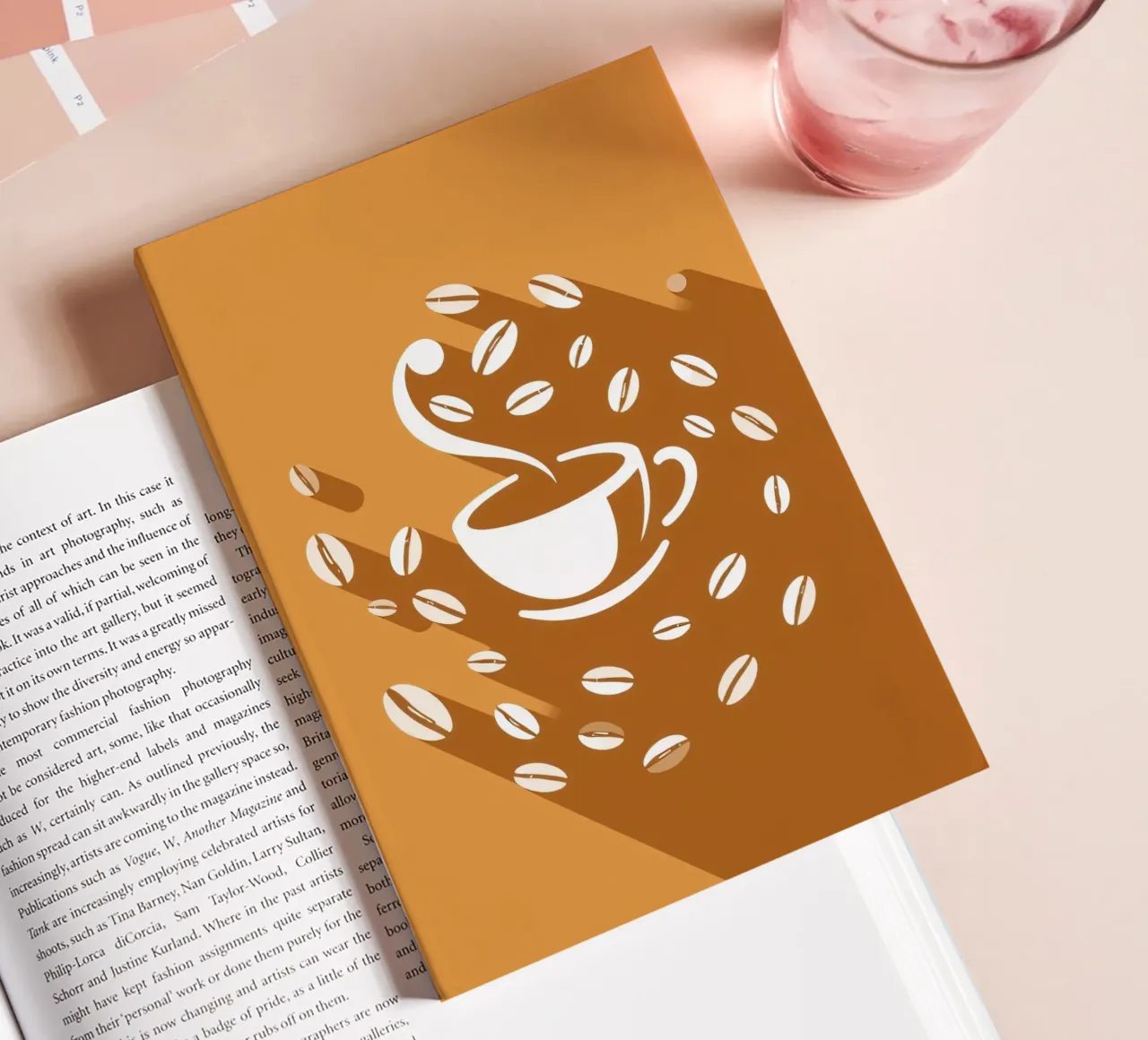 A steaming cup of coffee surrounded by scattered coffee bean notebook by DesignDoodle