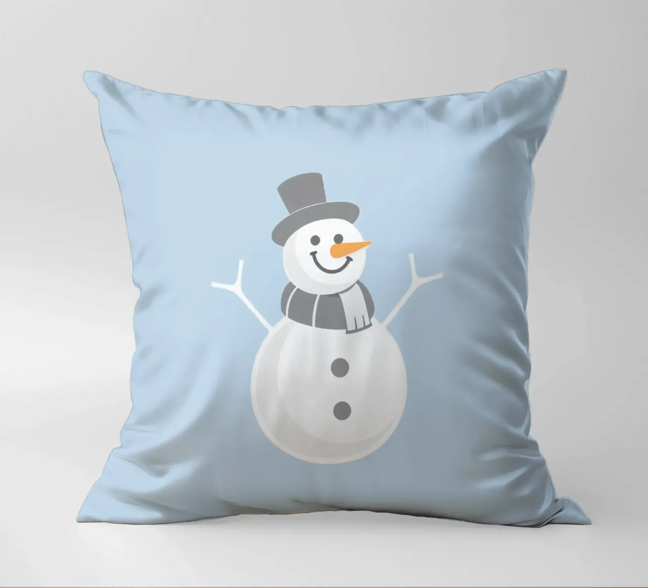 Un allegro pupazzo di neve che indossa un cappello nero e una sciarpa grigia cuscino da DesignDoodle