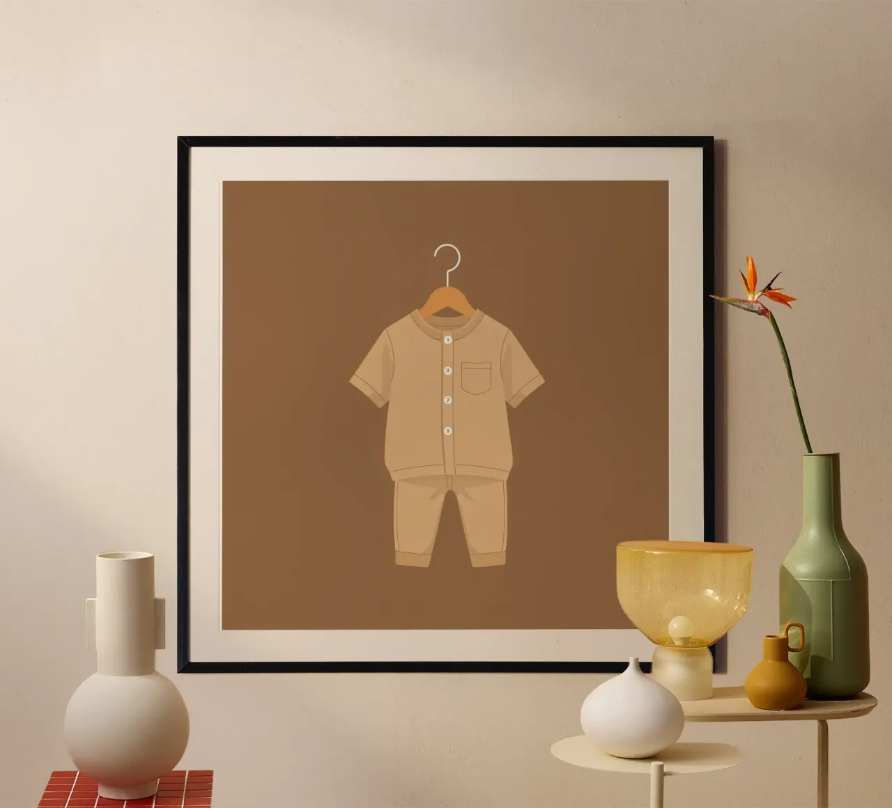 Un grazioso completino beige per bambini appeso ad una gruccia di legno ag poster da DesignDoodle