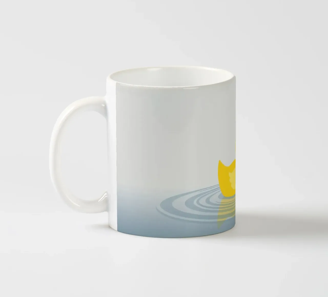 A cheerful yellow duck floats serenely on calm blue waters ceramic mug by DesignDoodle