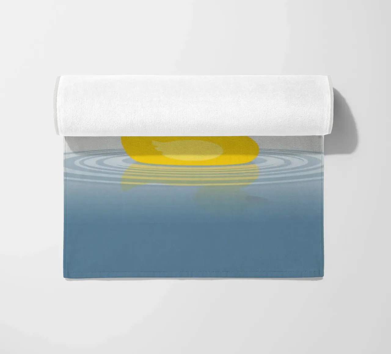 A cheerful yellow duck floats serenely on calm blue waters beach towel by DesignDoodle