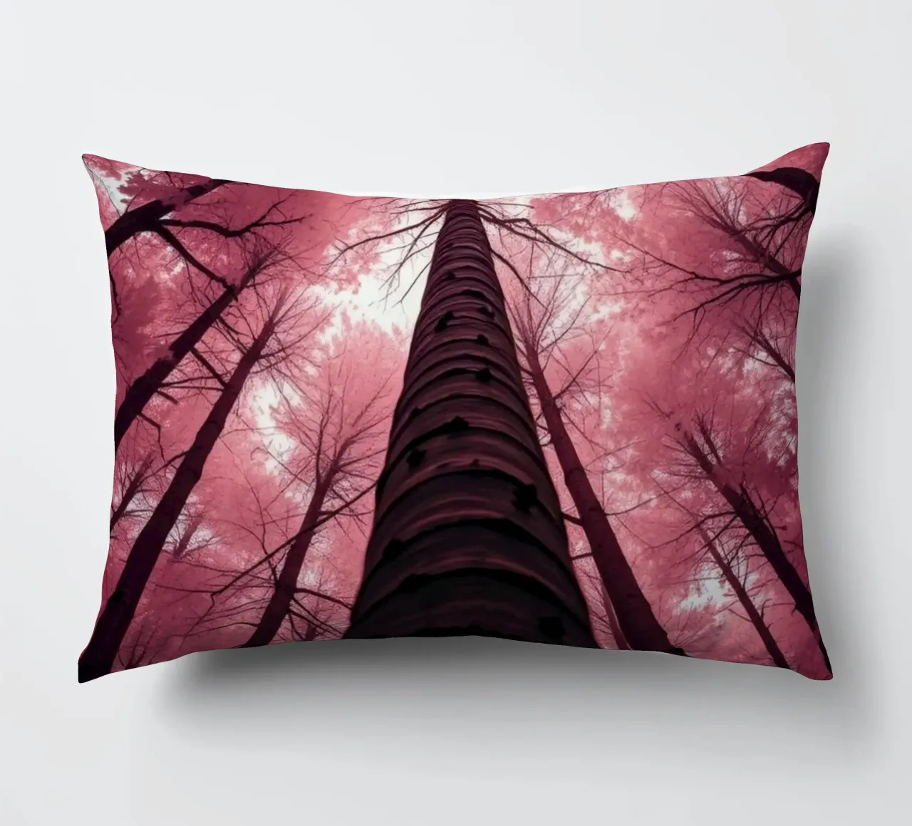 Tall trees stretch towards a pink sky creating a dreamy decorative cushion by DesignDoodle