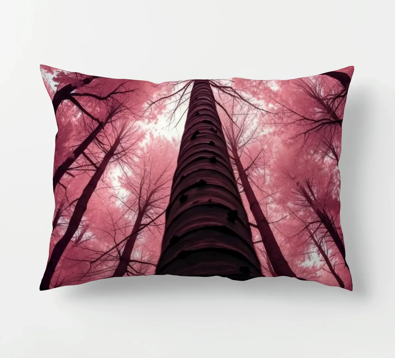 Tall trees stretch towards a pink sky creating a dreamy decorative cushion by DesignDoodle