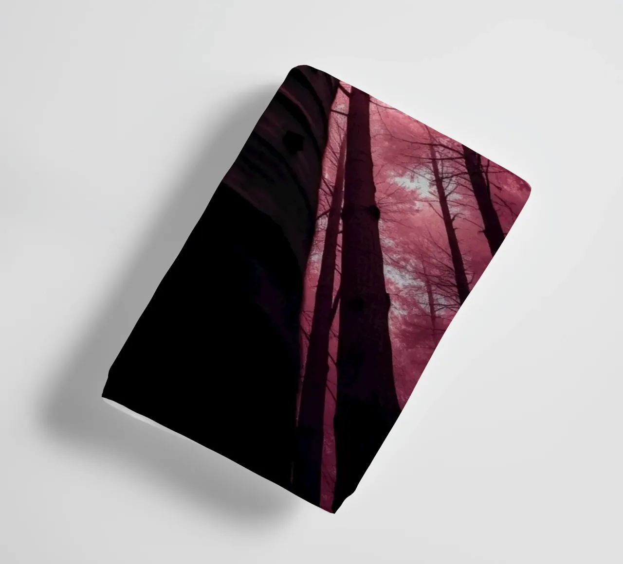 Tall trees stretch towards a pink sky creating a dreamy towel by DesignDoodle