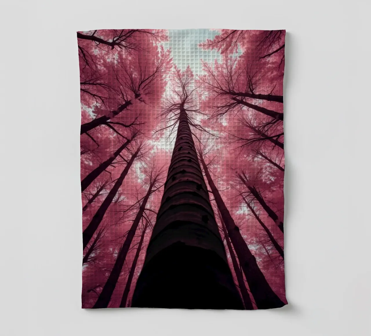 Tall trees stretch towards a pink sky creating a dreamy tea towel by DesignDoodle