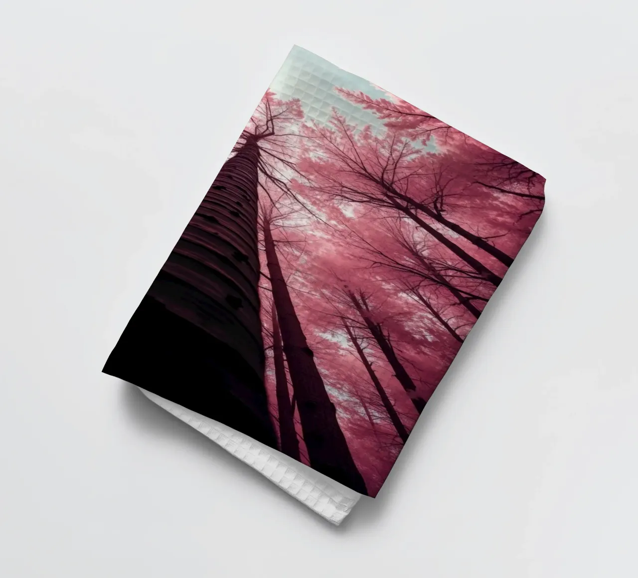 Tall trees stretch towards a pink sky creating a dreamy tea towel by DesignDoodle