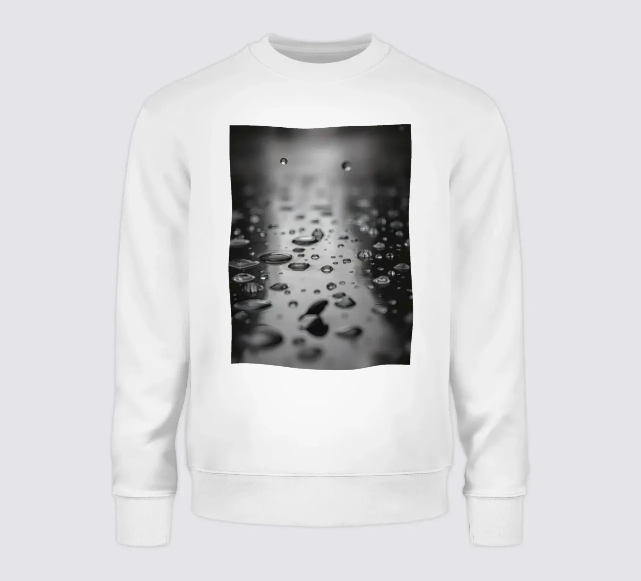 Raindrops creating reflections on a wet surface sweatshirt by DesignDoodle