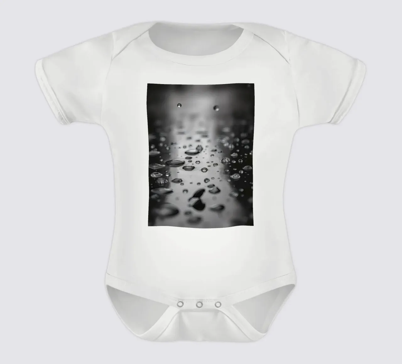 Raindrops creating reflections on a wet surface short-sleeve baby romper by DesignDoodle