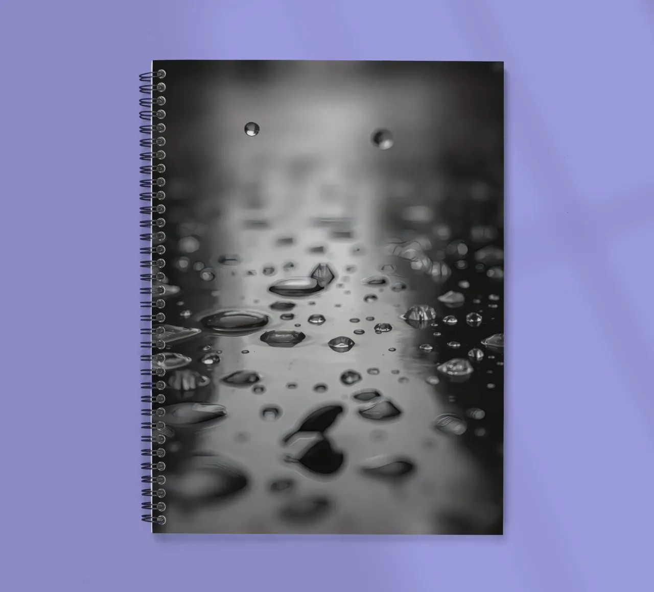 Raindrops creating reflections on a wet surface spiral notebook by DesignDoodle