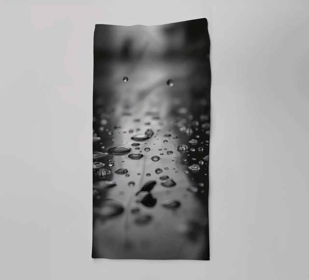 Raindrops creating reflections on a wet surface towel by DesignDoodle