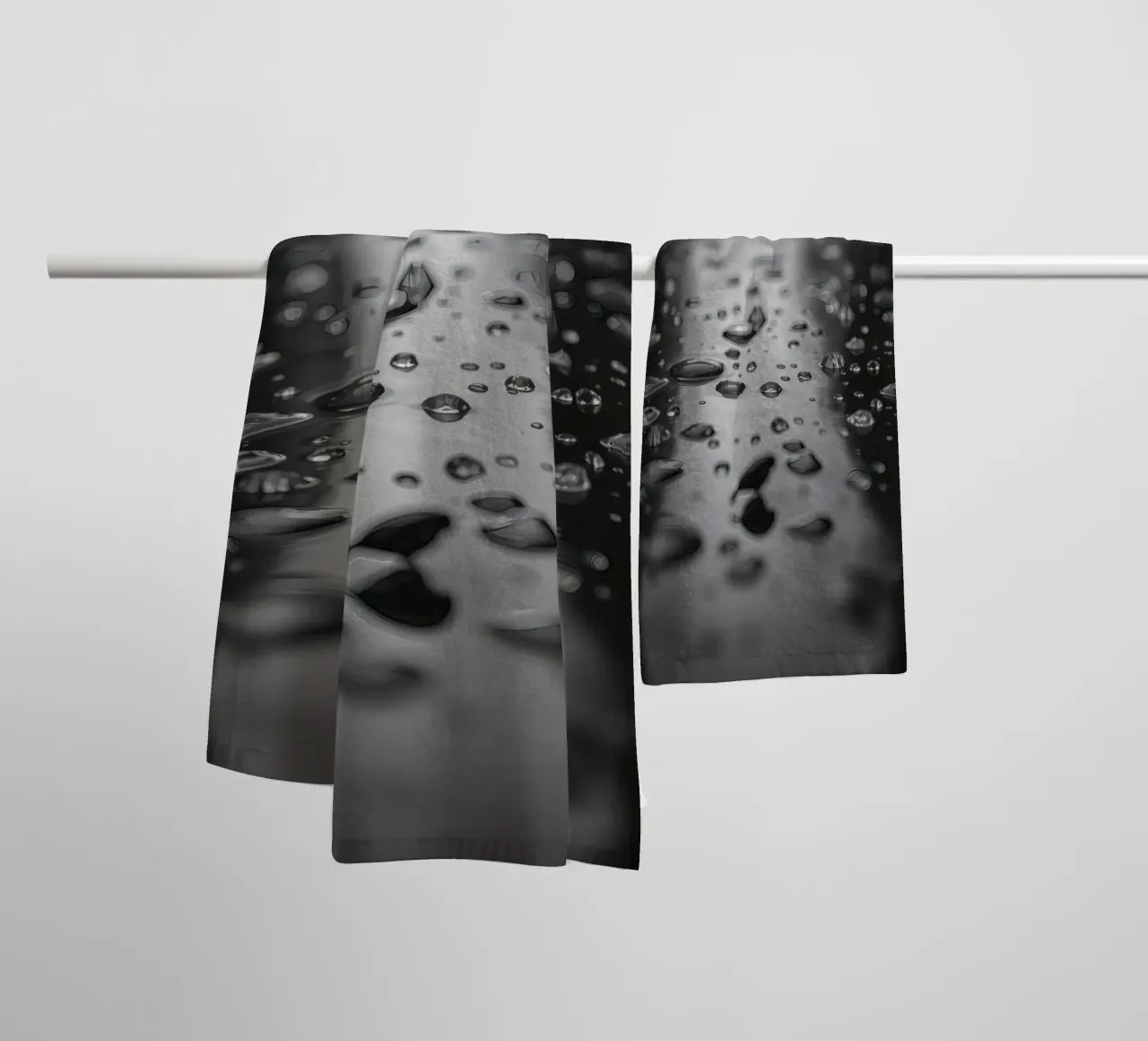 Raindrops creating reflections on a wet surface towel by DesignDoodle