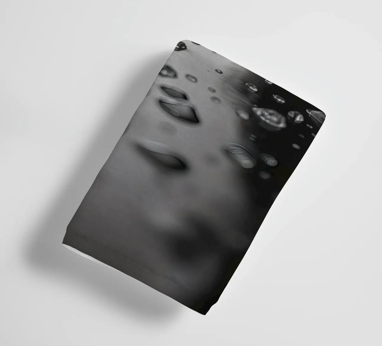 Raindrops creating reflections on a wet surface towel by DesignDoodle