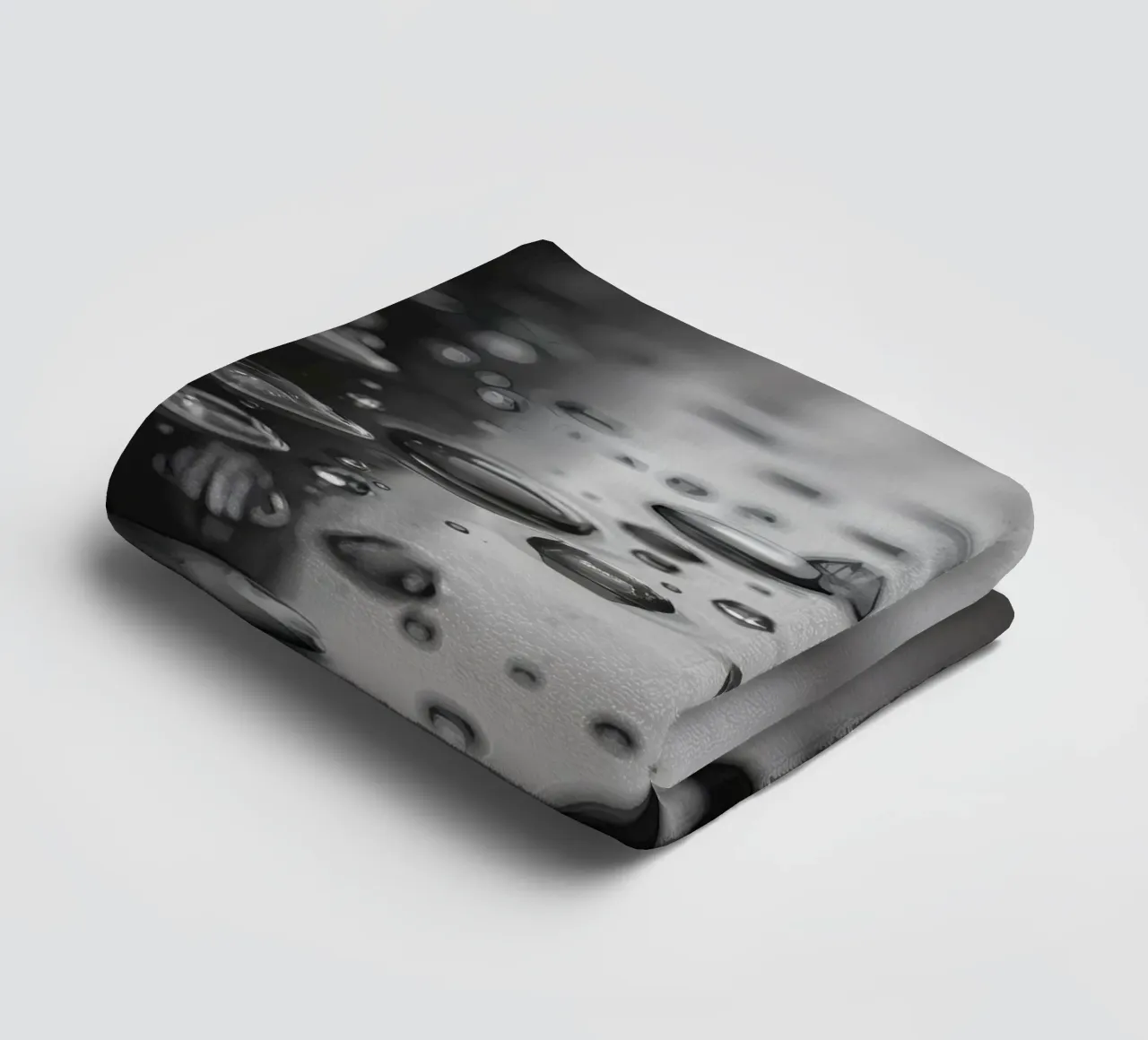 Raindrops creating reflections on a wet surface towel by DesignDoodle