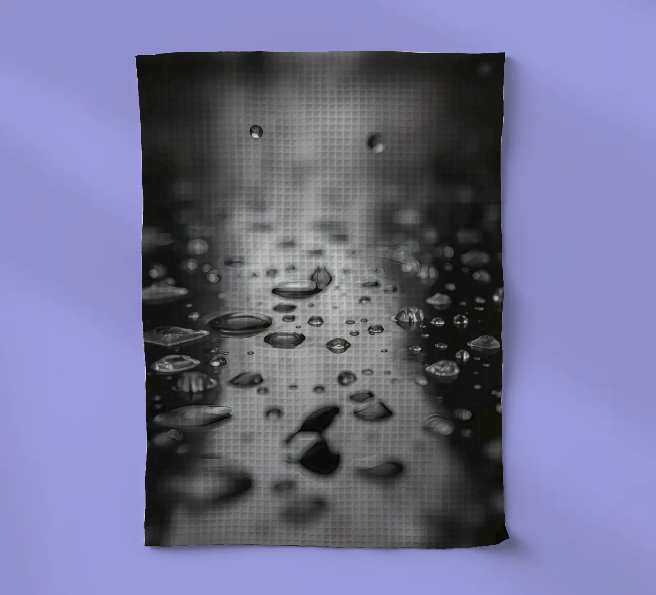 Raindrops creating reflections on a wet surface tea towel by DesignDoodle