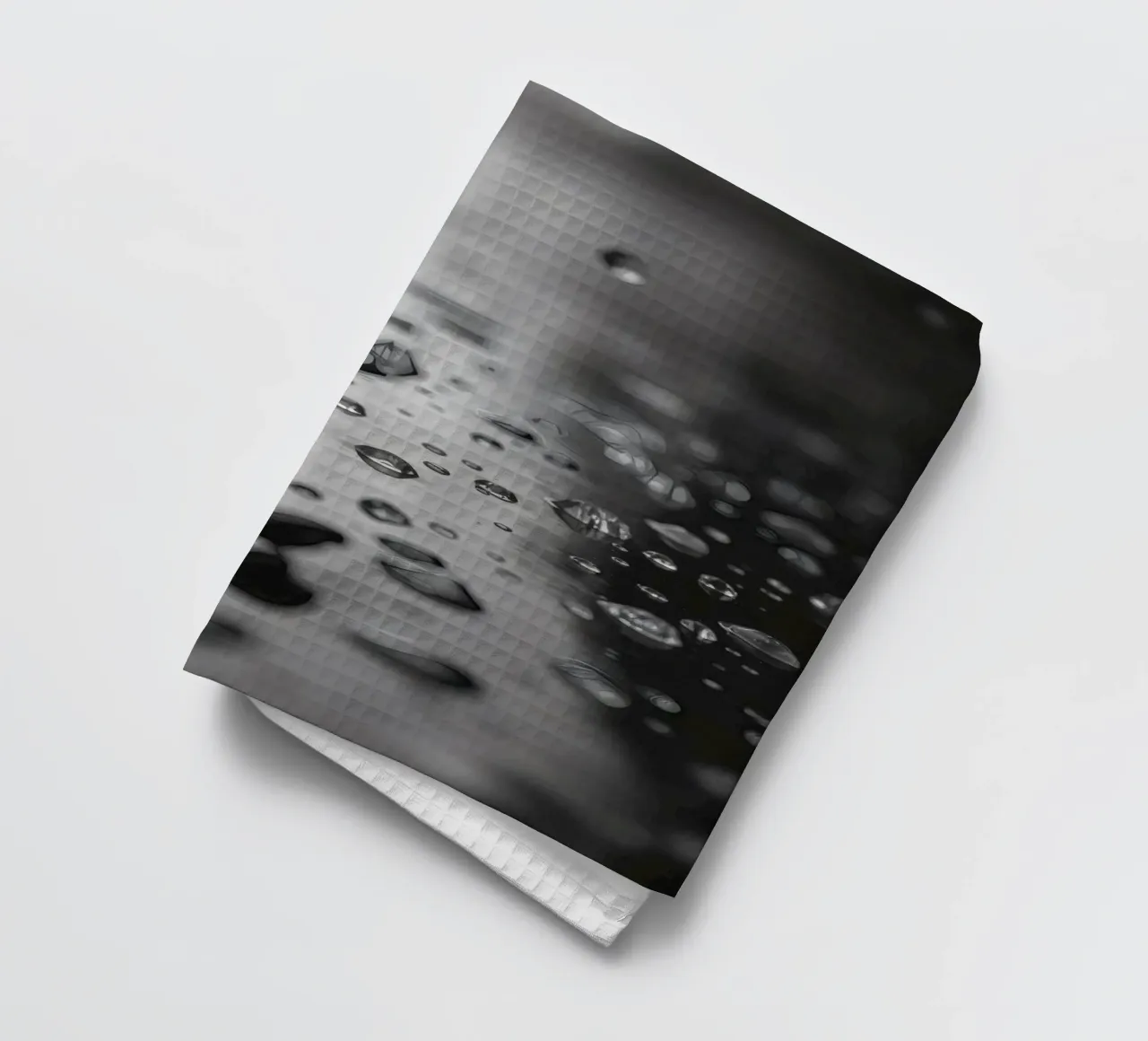 Raindrops creating reflections on a wet surface tea towel by DesignDoodle