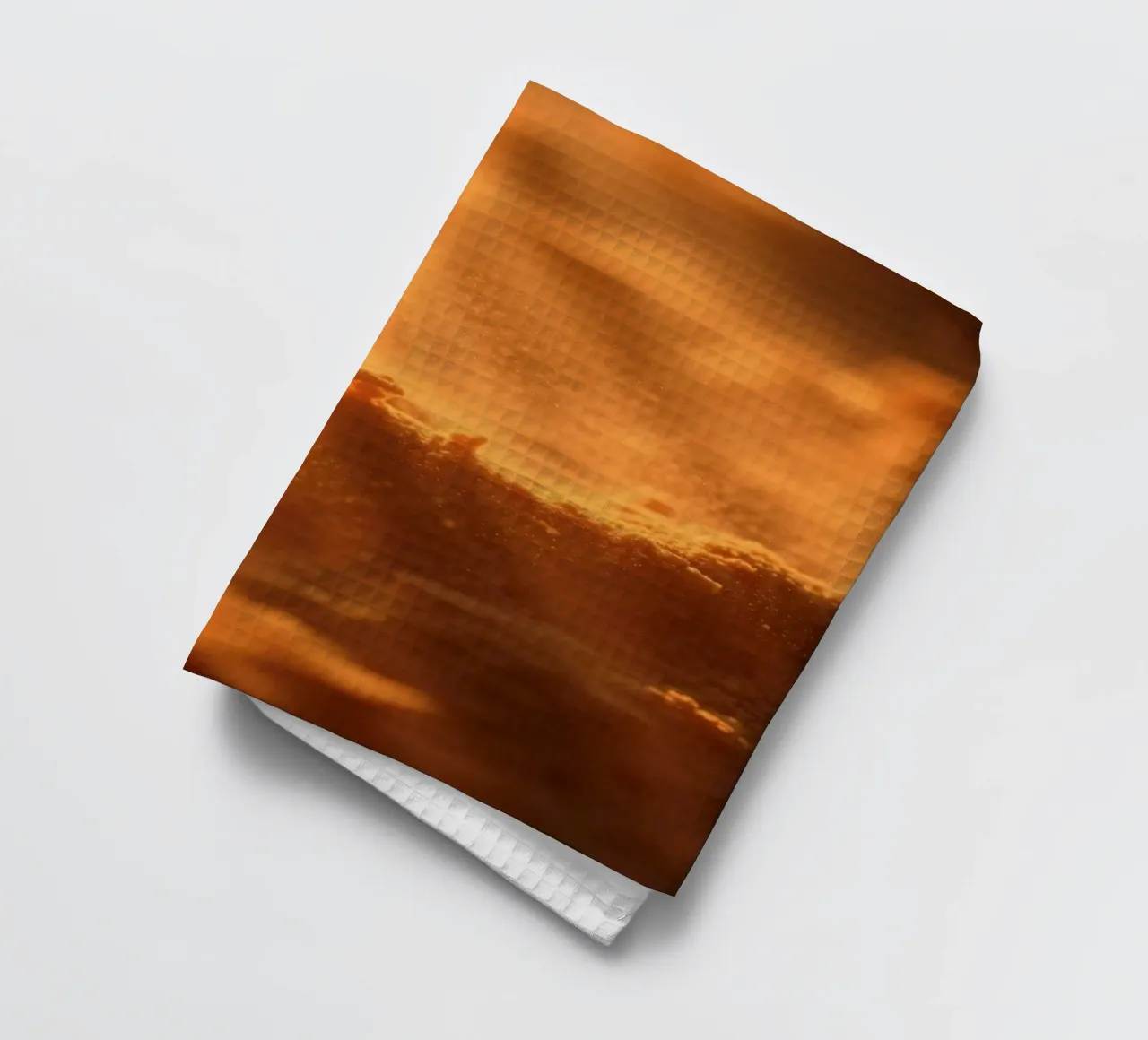 Texture sableuse éclairée par une lumière douce créant une sensation de chaleur torchon de DesignDoodle