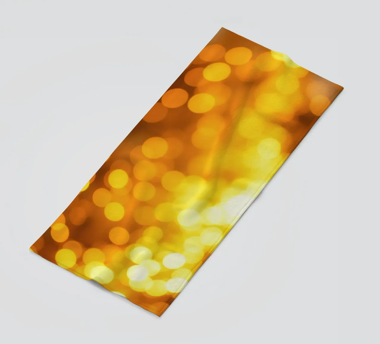 golden bokeh background design featuring abstract shimmerin beach towel by DesignDoodle